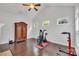 Bedroom with exercise equipment, hardwood floors, ceiling fan, and windows at 944 Treasure Ct, Fort Mill, SC 29708