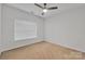 Neutral spare bedroom featuring carpet, natural light and a ceiling fan at 944 Treasure Ct, Fort Mill, SC 29708