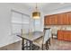 Bright dining area features a modern chandelier, hardwood floors, and a window providing natural light at 944 Treasure Ct, Fort Mill, SC 29708