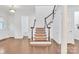 Bright foyer with hardwood floors, stairway and white wainscoting at 944 Treasure Ct, Fort Mill, SC 29708