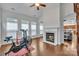 Living room featuring a fireplace and exercise equipment at 944 Treasure Ct, Fort Mill, SC 29708