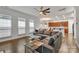 Bright living room with a ceiling fan and open concept to the kitchen at 944 Treasure Ct, Fort Mill, SC 29708