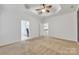 Bright main bedroom featuring plush carpeting, a ceiling fan and ample natural light at 944 Treasure Ct, Fort Mill, SC 29708