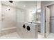 Contemporary bathroom showcasing a glass-enclosed shower, marble tile, and dual vanity at 9851 Quercus Ln, Huntersville, NC 28078