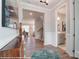 Elegant foyer with wood floors, decorative molding, and an open view into the dining and living area at 9851 Quercus Ln, Huntersville, NC 28078