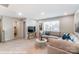 Cozy living room with plush seating, a modern coffee table, and large windows offering plenty of natural light at 9851 Quercus Ln, Huntersville, NC 28078