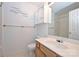 Bathroom featuring toilet, sink, shower with decor and ample counter space at 10422 Stokeshill Ct, Pineville, NC 28134
