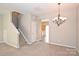 Dining area featuring a chandelier, neutral walls, carpet flooring and access to other rooms at 10422 Stokeshill Ct, Pineville, NC 28134