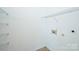 Laundry room space with hookups and wire rack shelving at 10422 Stokeshill Ct, Pineville, NC 28134