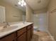 Bathroom featuring double sinks, shower-tub and tile flooring at 10927 Kinnairds St, Charlotte, NC 28278
