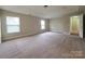 Spacious bedroom featuring plush carpeting and windows offering natural light at 10927 Kinnairds St, Charlotte, NC 28278