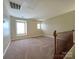 A spacious bonus room with carpeting and lots of natural light at 10927 Kinnairds St, Charlotte, NC 28278