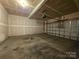 Attached garage with door and operating hardware at 10927 Kinnairds St, Charlotte, NC 28278