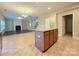 Spacious kitchen with island and sight lines to the living room and entry at 10927 Kinnairds St, Charlotte, NC 28278