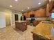 Kitchen with stainless steel appliances, wood cabinets, granite counters and a kitchen island at 10927 Kinnairds St, Charlotte, NC 28278