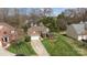 Beautiful aerial view showcasing the home's manicured lawn, mature trees, and classic brick exterior at 11542 Laurel View Dr, Charlotte, NC 28273