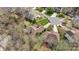 Wide aerial view featuring the house, surrounding neighborhood, mature trees, and nearby cul-de-sac at 11542 Laurel View Dr, Charlotte, NC 28273