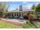 Backyard with patio furniture, outdoor grill, and a manicured lawn great for entertaining at 11542 Laurel View Dr, Charlotte, NC 28273