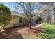 Spacious backyard features a patio, mature trees, and a garden, creating a serene setting at 11542 Laurel View Dr, Charlotte, NC 28273