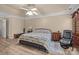 Comfortable bedroom with a ceiling fan, wood floors, and neutral walls offers a cozy retreat at 11542 Laurel View Dr, Charlotte, NC 28273
