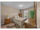 Neutral bedroom features natural light from the window and carpet flooring for a cozy feel at 11542 Laurel View Dr, Charlotte, NC 28273