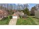 Beautiful brick home with a well-manicured lawn and two-car garage, nestled in a quiet neighborhood at 11542 Laurel View Dr, Charlotte, NC 28273