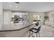 Kitchen features counter seating, tile backsplash, and stainless steel appliances at 11542 Laurel View Dr, Charlotte, NC 28273