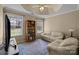 Living room with large windows, hardwood floors, and a traditional-style rug at 11542 Laurel View Dr, Charlotte, NC 28273