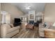 Spacious living room with vaulted ceilings, a brick fireplace, and neutral wall paint at 11542 Laurel View Dr, Charlotte, NC 28273