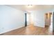 Cozy bedroom featuring fresh paint, laminate flooring, and a window at 1228 Hidden Creek Cir, Hickory, NC 28602