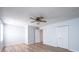 Bright bedroom with wood floors, fan, and large closet at 1228 Hidden Creek Cir, Hickory, NC 28602