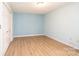 Bedroom with ample natural light, laminate flooring and closet at 1228 Hidden Creek Cir, Hickory, NC 28602