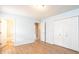 Bedroom featuring laminate flooring, fresh paint and a bathroom and closet at 1228 Hidden Creek Cir, Hickory, NC 28602