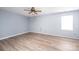 Inviting bedroom with wood flooring, light blue walls, and a ceiling fan at 1228 Hidden Creek Cir, Hickory, NC 28602