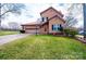 Charming two-story home featuring a red metal roof, a spacious front yard, and an attached two-car garage at 1228 Hidden Creek Cir, Hickory, NC 28602
