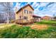 View of the house from the side yard showing deck and red metal roof at 1228 Hidden Creek Cir, Hickory, NC 28602