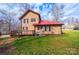 Back of home showing the yard, deck, and a red metal roof at 1228 Hidden Creek Cir, Hickory, NC 28602