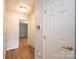 Hallway featuring fresh paint and laminate flooring at 1228 Hidden Creek Cir, Hickory, NC 28602