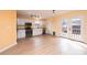 Bright kitchen featuring white cabinetry, stainless steel appliances, and a door leading to the outside deck at 1228 Hidden Creek Cir, Hickory, NC 28602