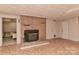 This basement includes a brick fireplace and shelving for plenty of storage at 1235 Robinhood Cir, Charlotte, NC 28227