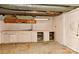 This room in the basement offers a workbench, cabinets, and pegboard wall storage at 1235 Robinhood Cir, Charlotte, NC 28227