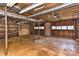 This spacious unfinished basement could be used for parking or an indoor workshop at 1235 Robinhood Cir, Charlotte, NC 28227