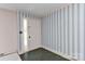 A simple entryway with decorative wallpaper and a practical tiled floor at 1235 Robinhood Cir, Charlotte, NC 28227