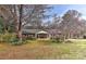 Charming brick home featuring a well-maintained lawn and a cozy front porch at 1235 Robinhood Cir, Charlotte, NC 28227