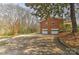 A two-car garage with a large parking pad, offering ample space for vehicles at 1235 Robinhood Cir, Charlotte, NC 28227