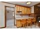 Eat-in kitchen area includes a breakfast bar with seating and view into adjacent room at 1235 Robinhood Cir, Charlotte, NC 28227
