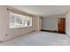 Bright and airy living room with a bay window at 1235 Robinhood Cir, Charlotte, NC 28227
