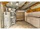 This utility room has a newer water heater and open shelves for storage at 1235 Robinhood Cir, Charlotte, NC 28227