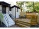 Backyard with new stairs and a wooden deck at 1239 Reece Rd, Charlotte, NC 28209
