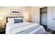 Bright bedroom featuring hardwood floors, neutral walls, and minimalist decor, creating a serene and inviting space at 1239 Reece Rd, Charlotte, NC 28209